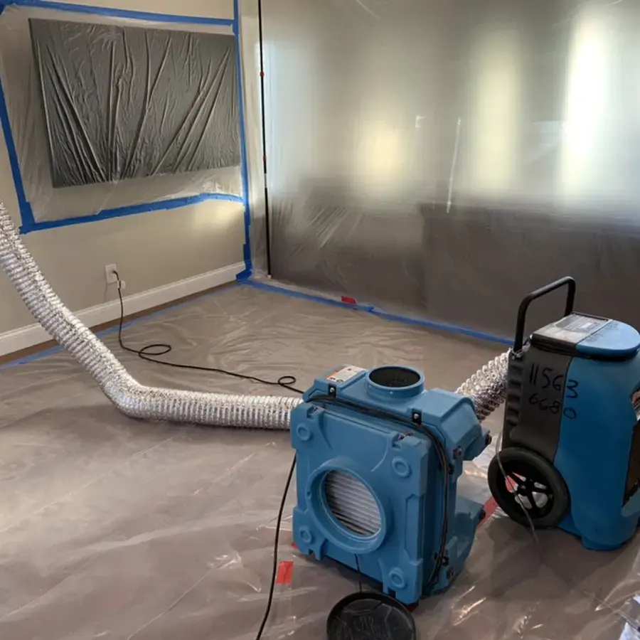 Containment and a dehumidifier set up during a Fullerton water damage dry-out