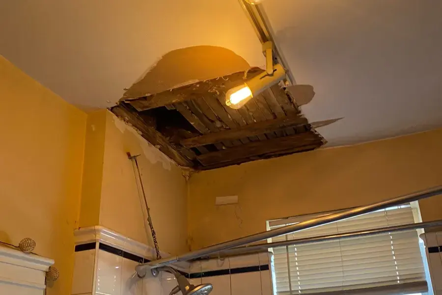 Ceiling damage from an upstairs unit leak in a Fullerton apartment