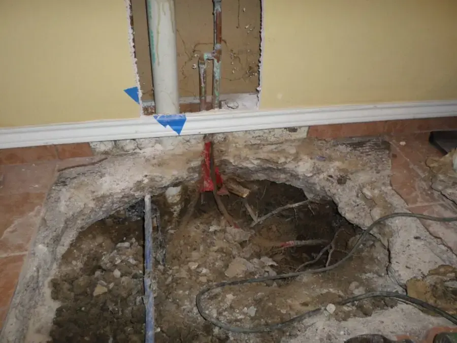 Flooring lifted over a slab leak in a Fullerton home
