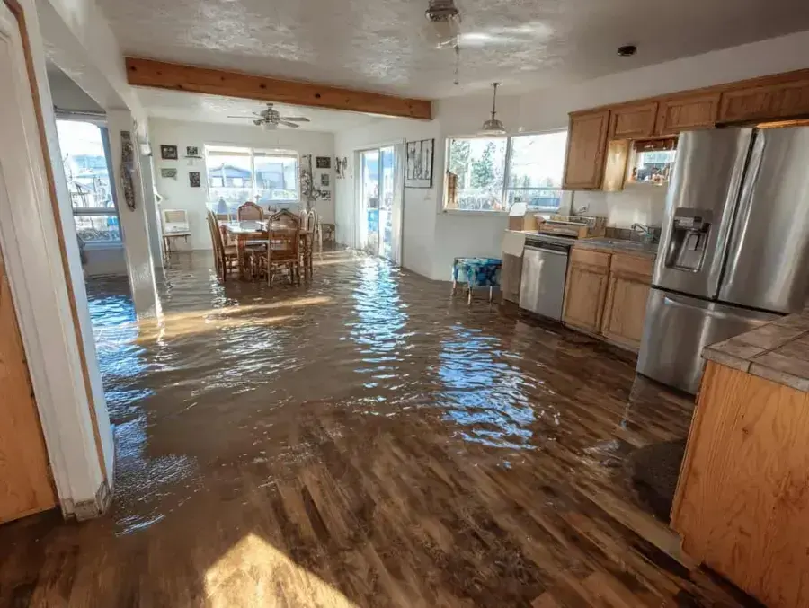 Storm water flooding into a Fullerton home after a winter storm